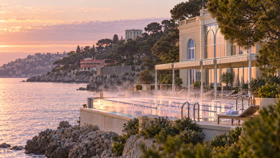 Steam lifts off the sea-water pool at dawn