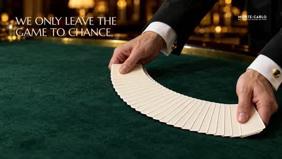 A croupier fans blank cards across green baize